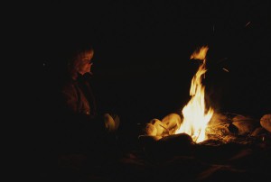woman-at-a-campfire-at-night-todd-gipstein